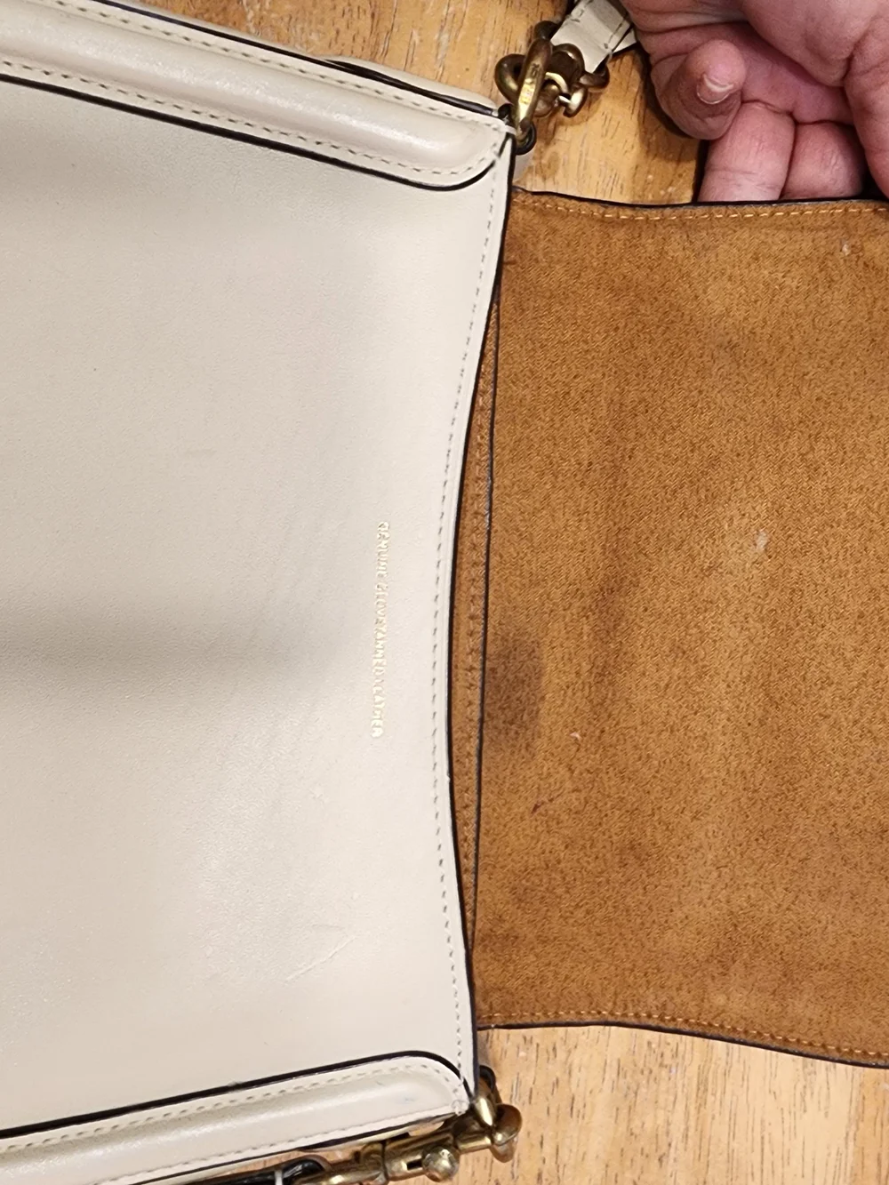 2021 Ivory Coach Beat saddle bag is crafted from glovetanned leather and brass